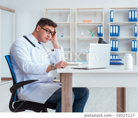 Tired doctor after night shift 59325117