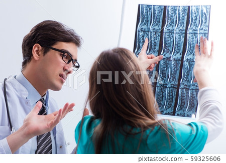 The three doctors discussing scan results of x-ray image 59325606