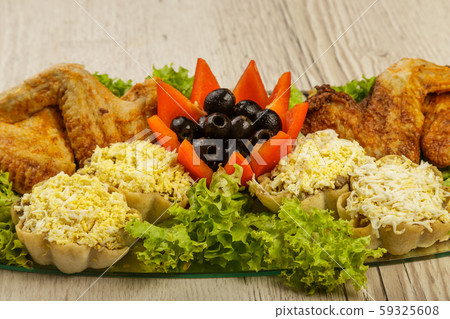 Dish from tartlets and chicken wings with the 59325608