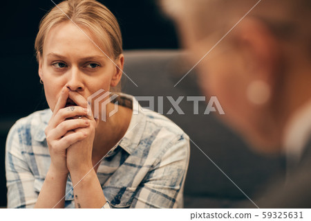 Upset woman at psychologist's office Upset woman at psychologist's office 59325631