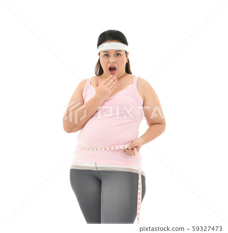 Overweight Asian woman measuring her waistline fat tummy isolated on white background 59327473