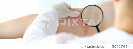 Male doctor in white protective gloves examing patient Male doctor in white protective gloves examing patient 59327674
