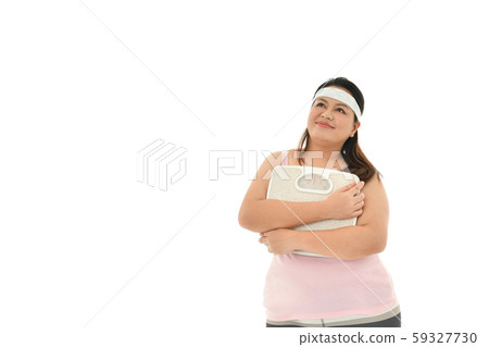 Overweight Asian woman with scale isolated on white background Overweight Asian woman with scale isolated on white background 59327730