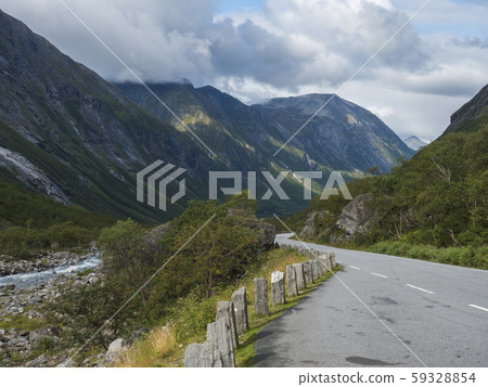 Winding road with mountain massif Trolltindene, Winding road with mountain massif Trolltindene, 59328854