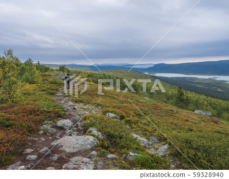 Man backpack hiker at Kungsleden trail admiring 59328940