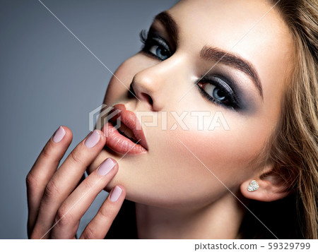 Closeup face of a beautiful girl with makeup in Closeup face of a beautiful girl with makeup in 59329799