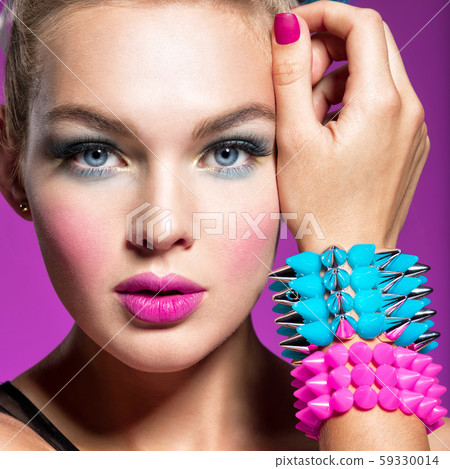 Fashion portrait of a beautiful woman with bright 59330014