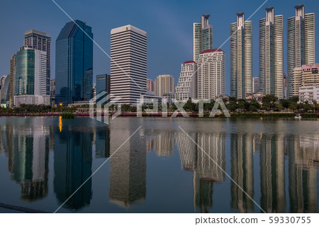 BANGKOK, THAILAND - 7 Nov 2019  :Reflection office building water front a Benjakiti green park 59330755