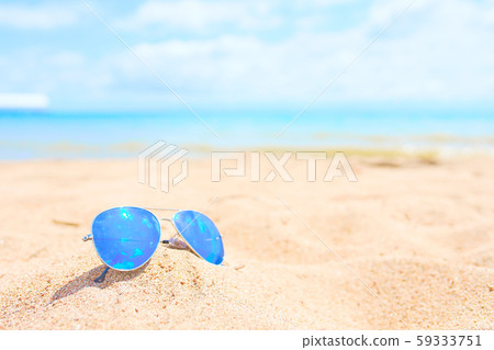 Sunglasses on the beach. Sunglasses on the beach. 59333751
