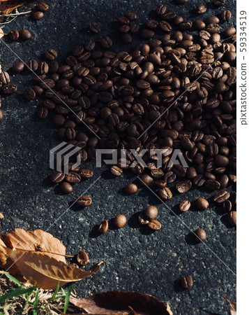 Roasted coffee beans and fallen leaves 59334519