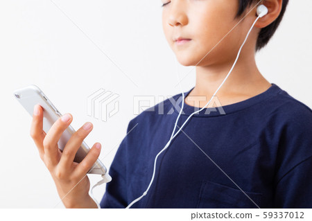 Boy, looking at smartphone Boy, looking at smartphone 59337012