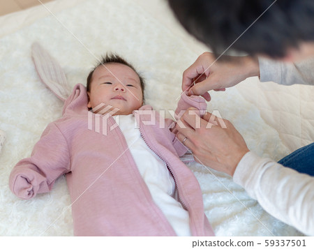 Baby changing clothes Baby changing clothes 59337501