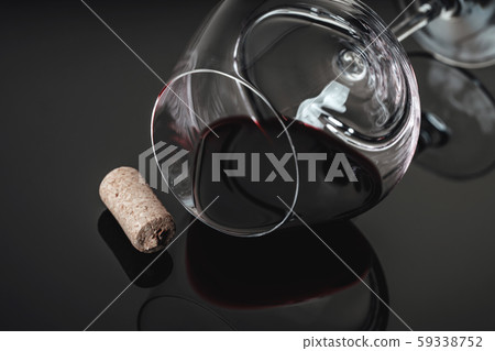 lying glass with red wine 59338752