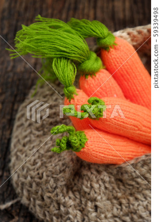knitted carrot with green leaf in basket, handmade product for home ornaments 59339498