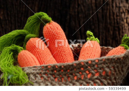 knitted carrot with green leaf in basket, handmade product for home ornaments 59339499