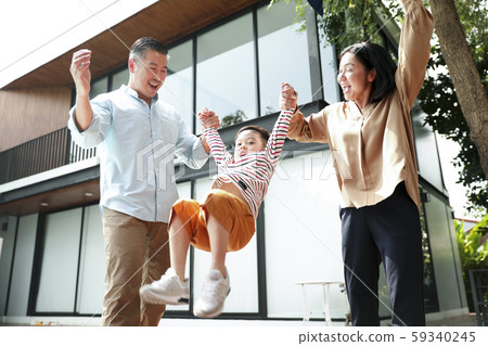 Family lifestyle playing in the garden 59340245
