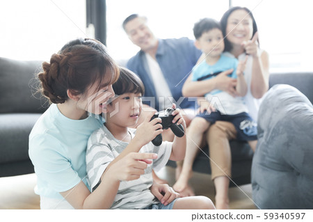 Family Lifestyle Parents and children playing games 59340597