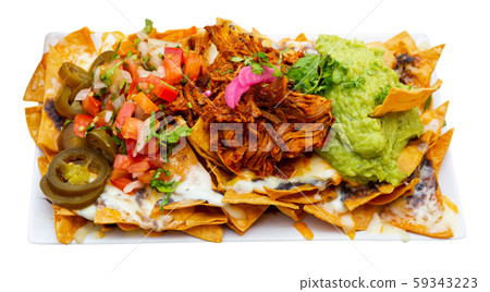 Corn chips nachos with homemade guacamole sauce, meat, cheese Corn chips nachos with homemade guacamole sauce, meat, cheese 59343223