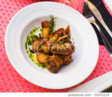 Rabbit meat served with peas Rabbit meat served with peas 59343224