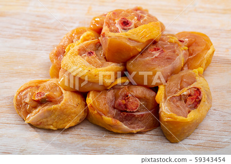 Raw sliced transversely chicken legs 59343454