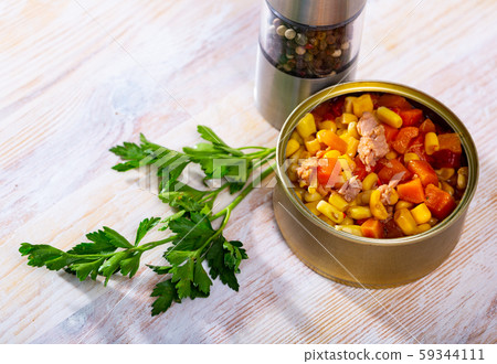 Milanese tuna salad with corn and boiled carrot in tin can 59344111