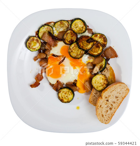 Plate with scrambled eggs with lard and zucchini Plate with scrambled eggs with lard and zucchini 59344421