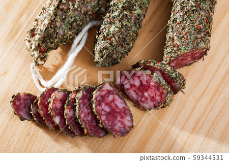 Sliced spanish sausage fuet with herbs Sliced spanish sausage fuet with herbs 59344531