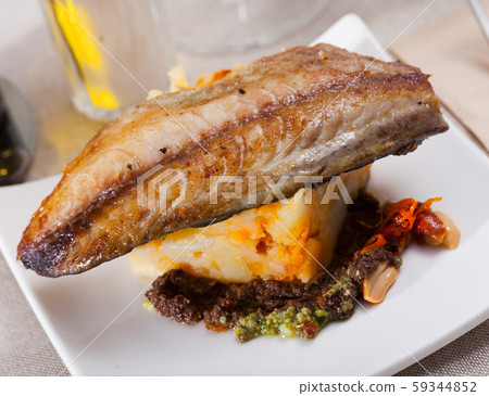 Baked mackerel fillet with potatoes Baked mackerel fillet with potatoes 59344852