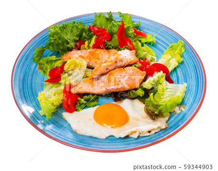 Tasty breakfast with trout, egg, pepper and lettuce at plate on table Tasty breakfast with trout, egg, pepper and lettuce at plate on table 59344903
