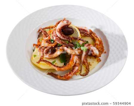 Fried tentacles squid with potatoes 59344904