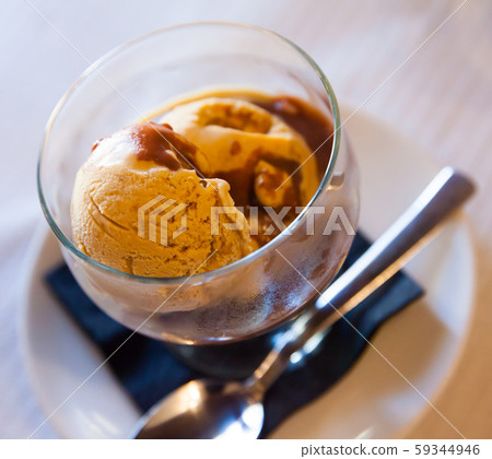 Sweet tasty chocolate ice-cream, served with hot chocolate Sweet tasty chocolate ice-cream, served with hot chocolate 59344946
