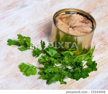 Preserved pink salmon with parsley Preserved pink salmon with parsley 59344948