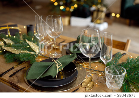 Table served for Christmas dinner in living room, close-up view, table setting, Christmas decoration 59348675