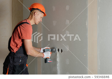 Making holes in the drywall. 59348846