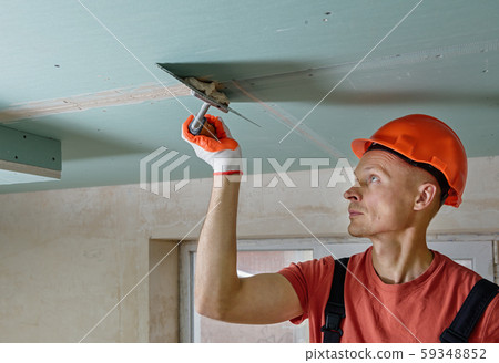 Filling the seams plasterboards. 59348852