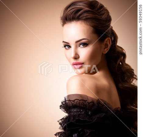 Fashion model. Model with a long curly hair. 59349156