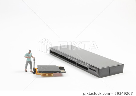 A Mini Worker Working On Sd Card. 59349267