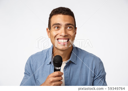 Close-up portrait look upper right corner joyful, laughing and smiling, perform stand-up or singing 59349764