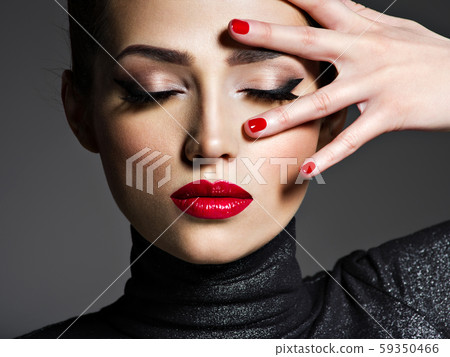 Beautiful woman with bright make-up and red nails. Beautiful woman with bright make-up and red nails. 59350466