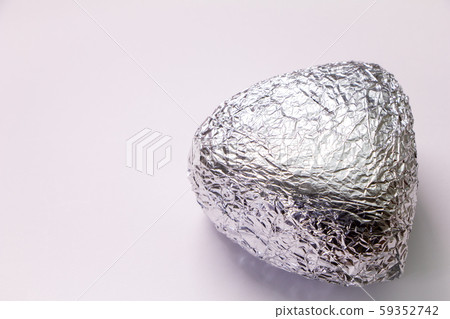 Triangle rice balls wrapped in aluminum foil. Triangle rice balls wrapped in aluminum foil. 59352742