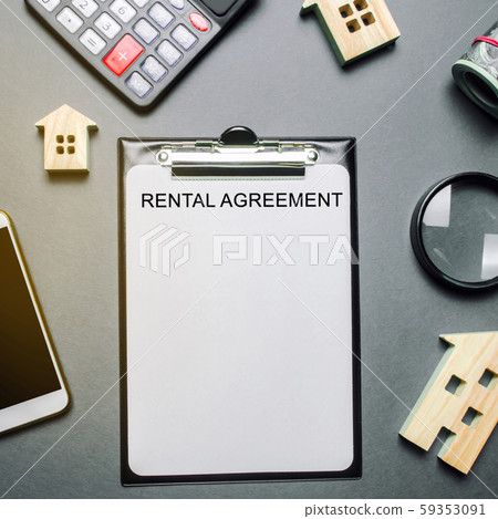 Desk real estate agent and tablet with the word Rental Agreement. The concept of a successful rental house or apartment. Property. Wooden houses, calculator, coins, magnifying glass. Flat lay Desk real estate agent and tablet with the word Rental Agreement. The concept of a successful rental house or apartment. Property. Wooden houses, calculator, coins, magnifying glass. Flat lay 59353091