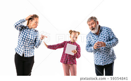 Family members with one another on white studio background. 59354841