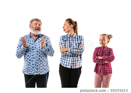 Family members arguing with one another on white studio background. Family members arguing with one another on white studio background. 59355013