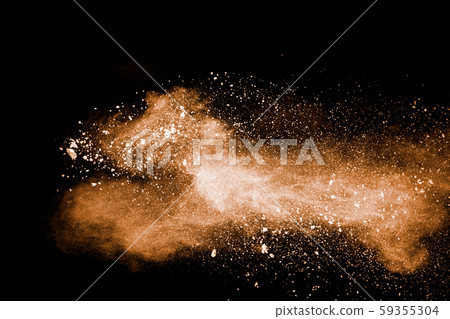 Freeze motion of brown dust explosion.Stopping the movement of brown powder.Explosive brown powder on black background. 59355304