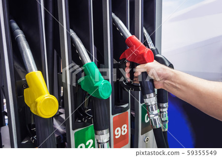 Pump nozzles at the gas station 59355549