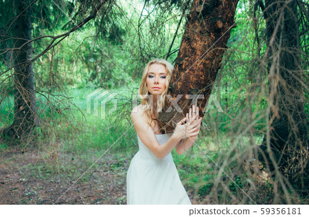 Portrait of young blond bride in forest Portrait of young blond bride in forest 59356181