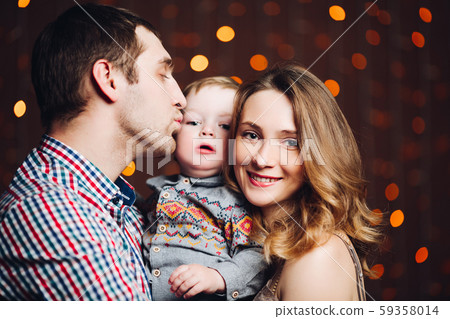 Portrait of happy family sitting together and Portrait of happy family sitting together and 59358014