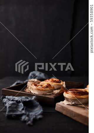 Fresh danish pastry with raisins on wood 59358901