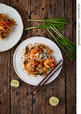 Padthai noodles with shrimps and vegetables. Padthai noodles with shrimps and vegetables. 59358934