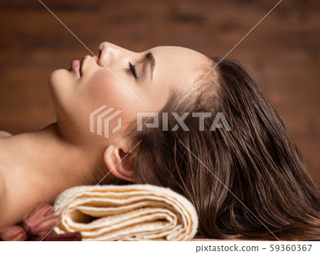 young woman relaxing in spa salon. Beauty young woman relaxing in spa salon. Beauty 59360367
